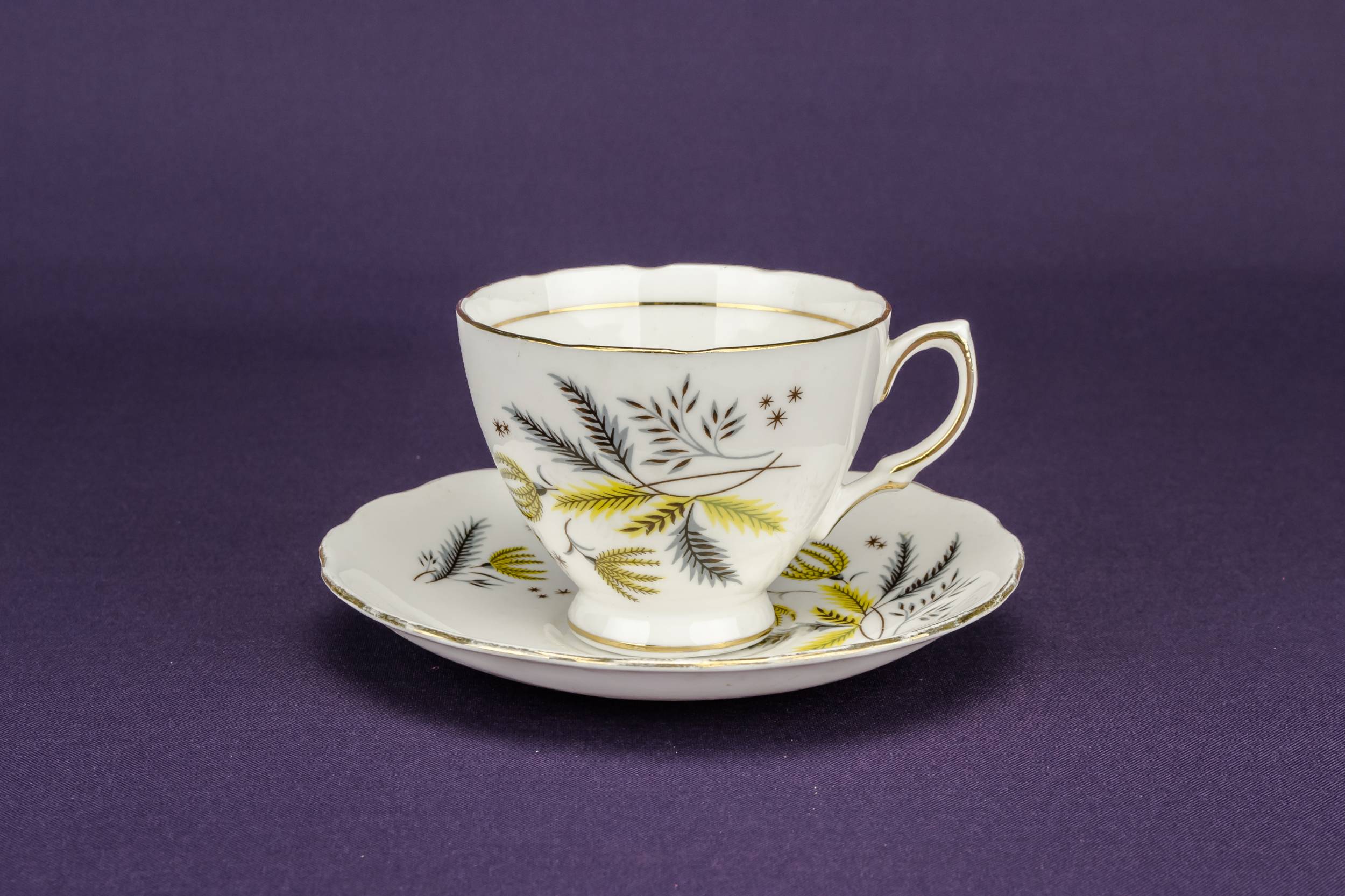Persons Modernist Porcelain — 2 yellow teacups and saucers