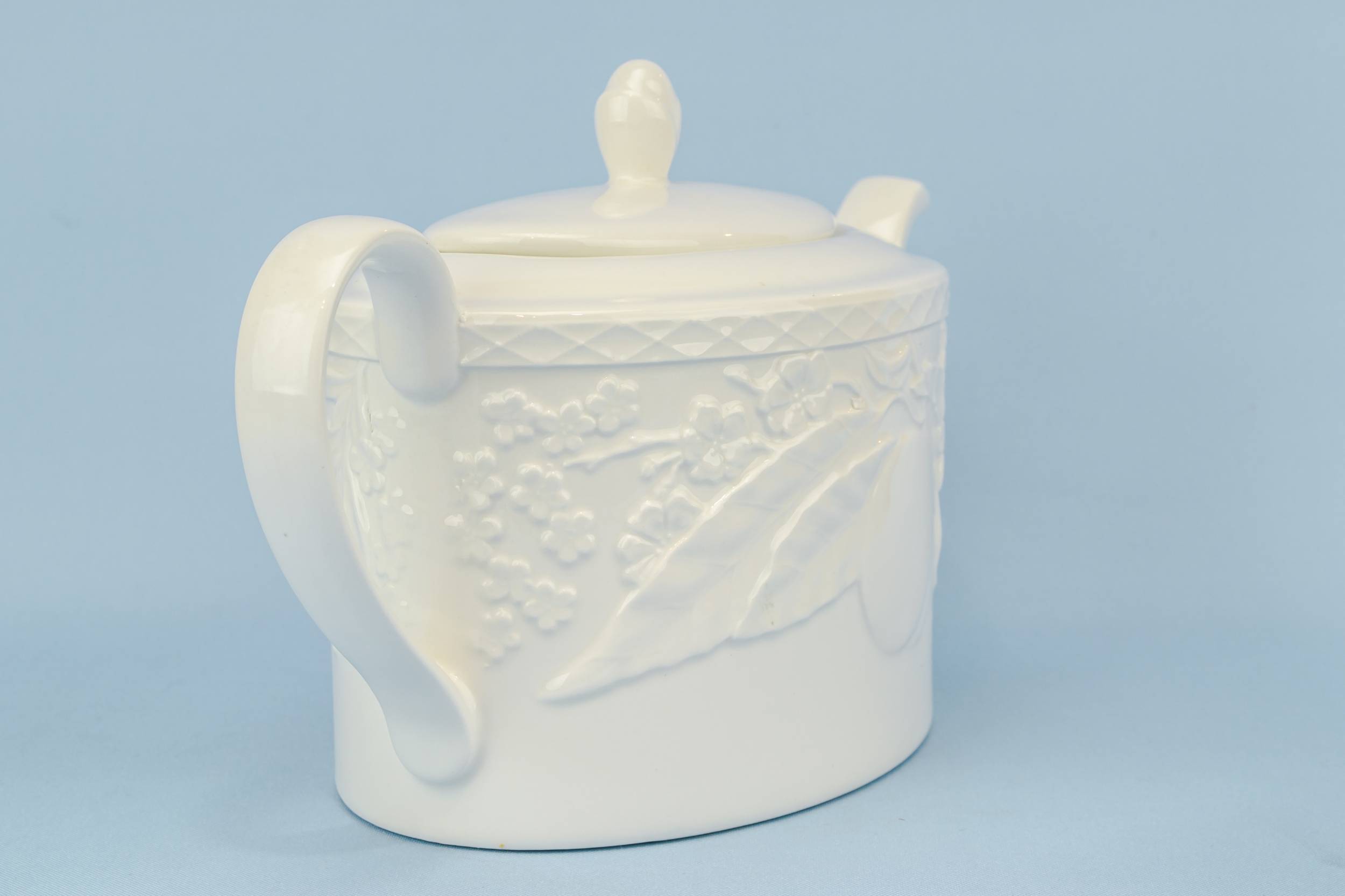 Porcelain Vintage TEAPOT — Moulded white teapot 1