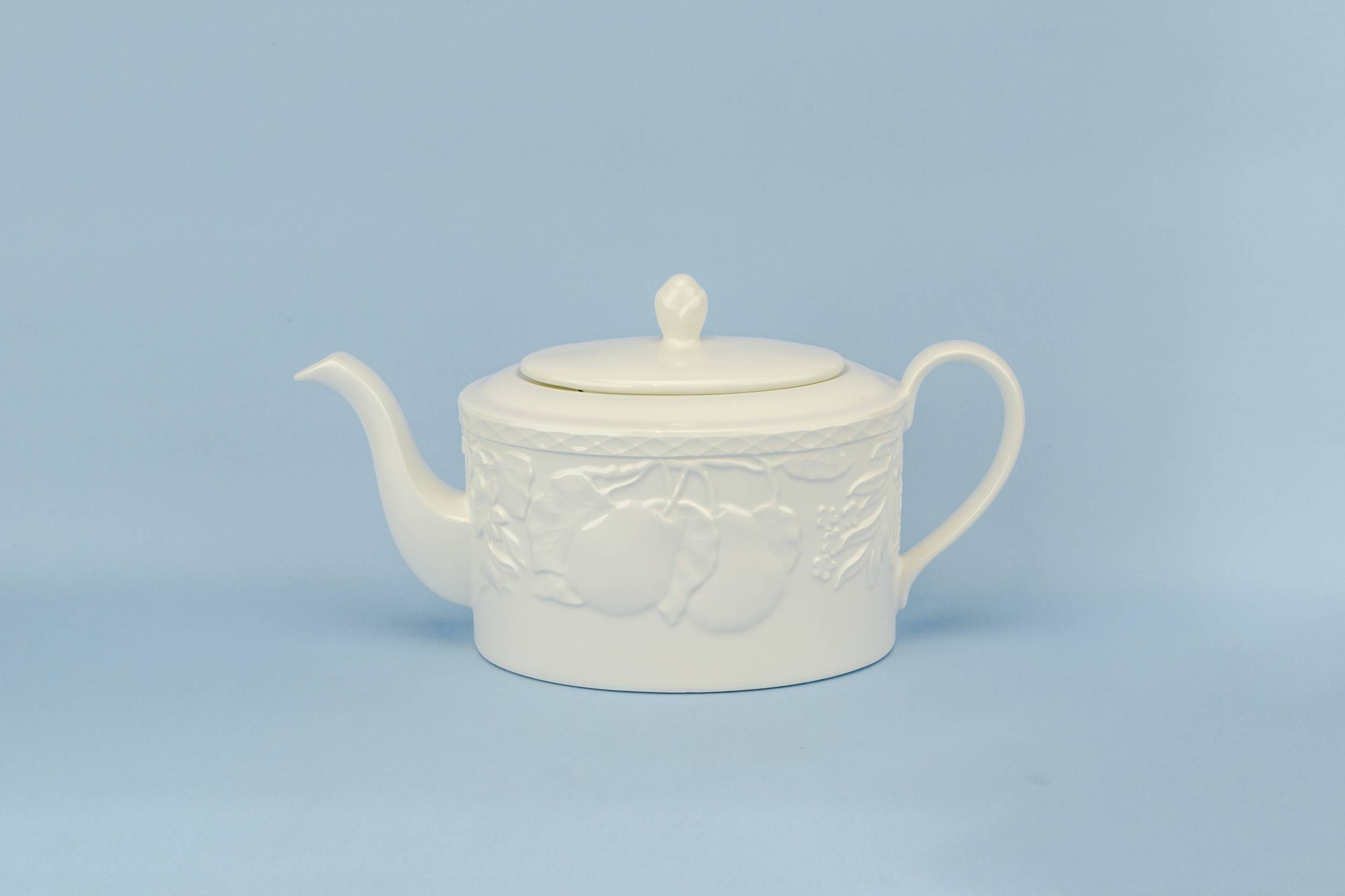 Porcelain Vintage TEAPOT — Moulded white teapot