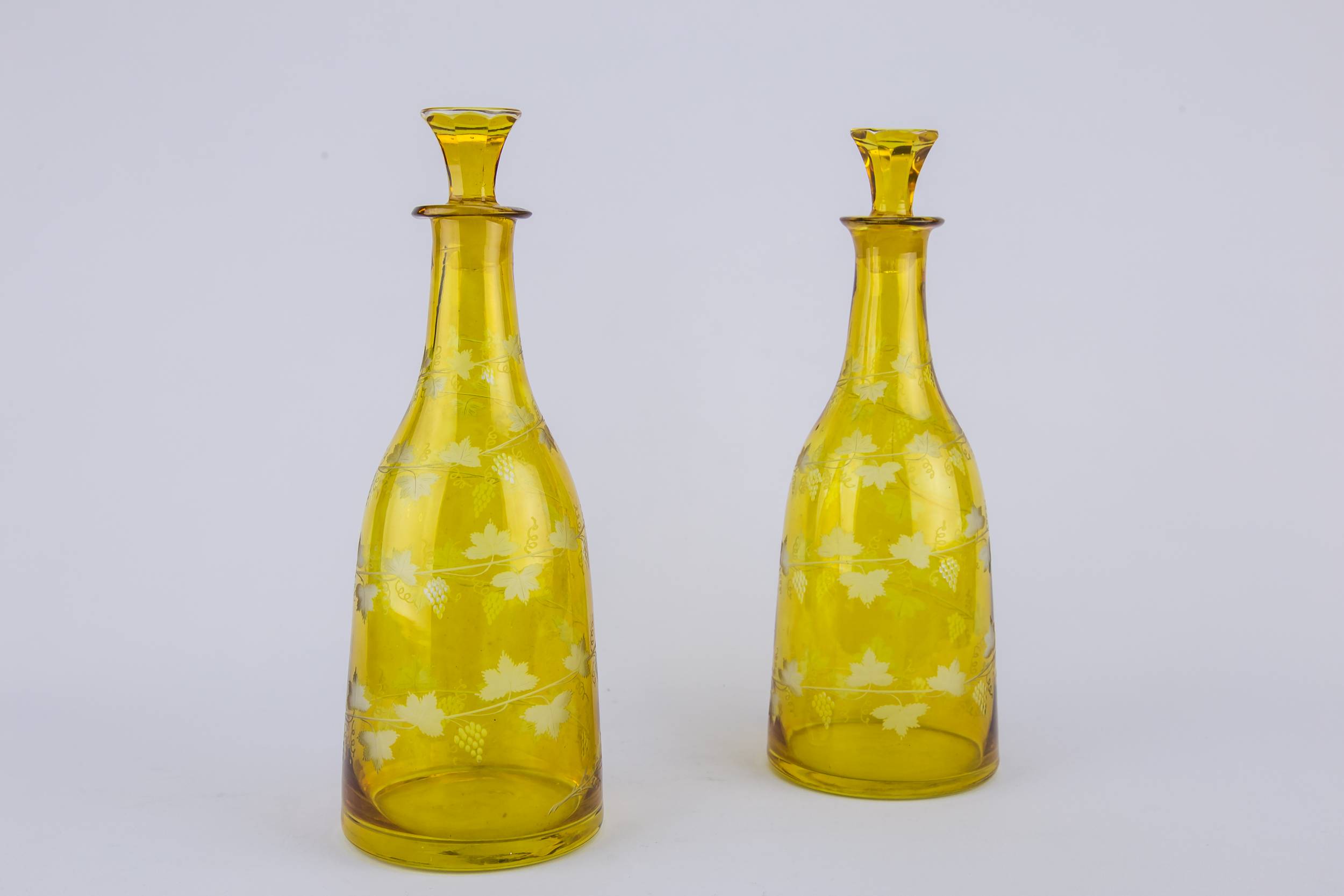 Tapered Wine Bottles — 2 yellow glass wine bottles 1