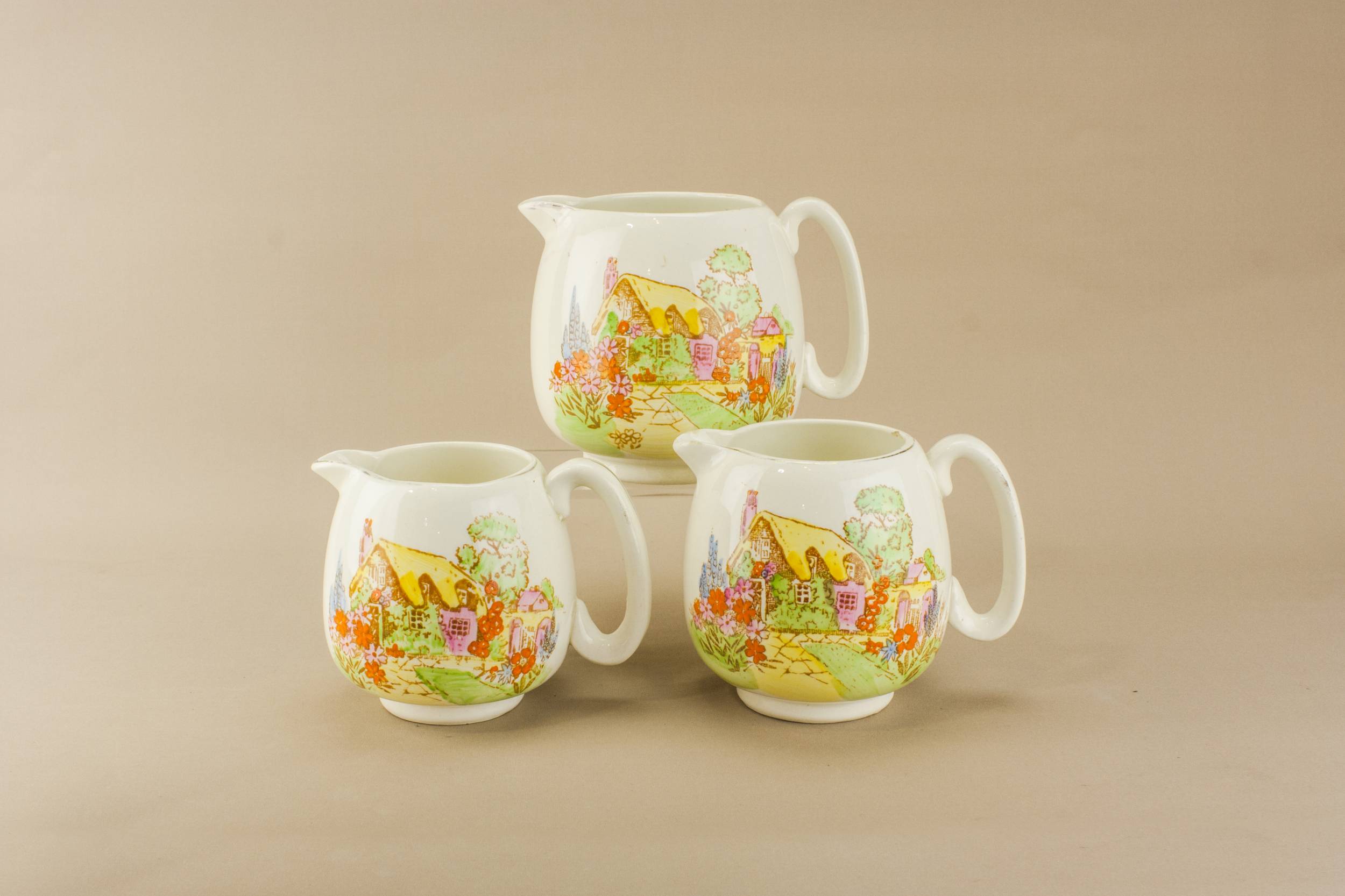 Three Spectacular Art — Three yellow pottery jugs