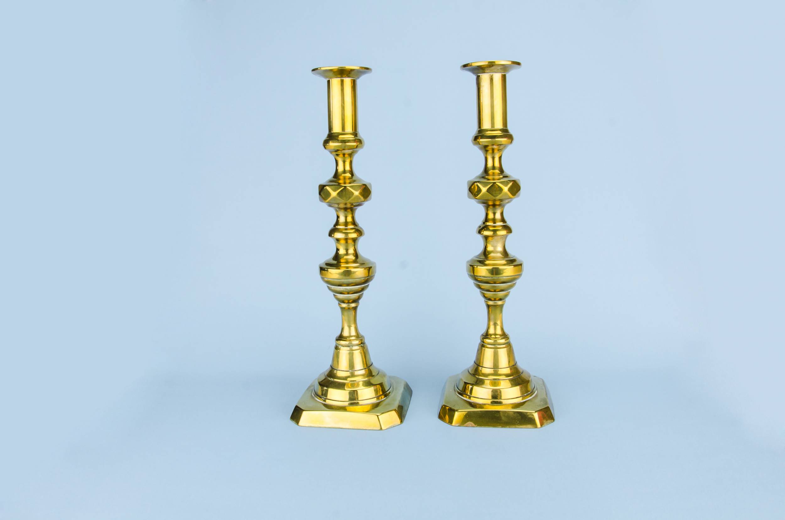 Antique Brass Faceted — Pair of brass candlesticks
