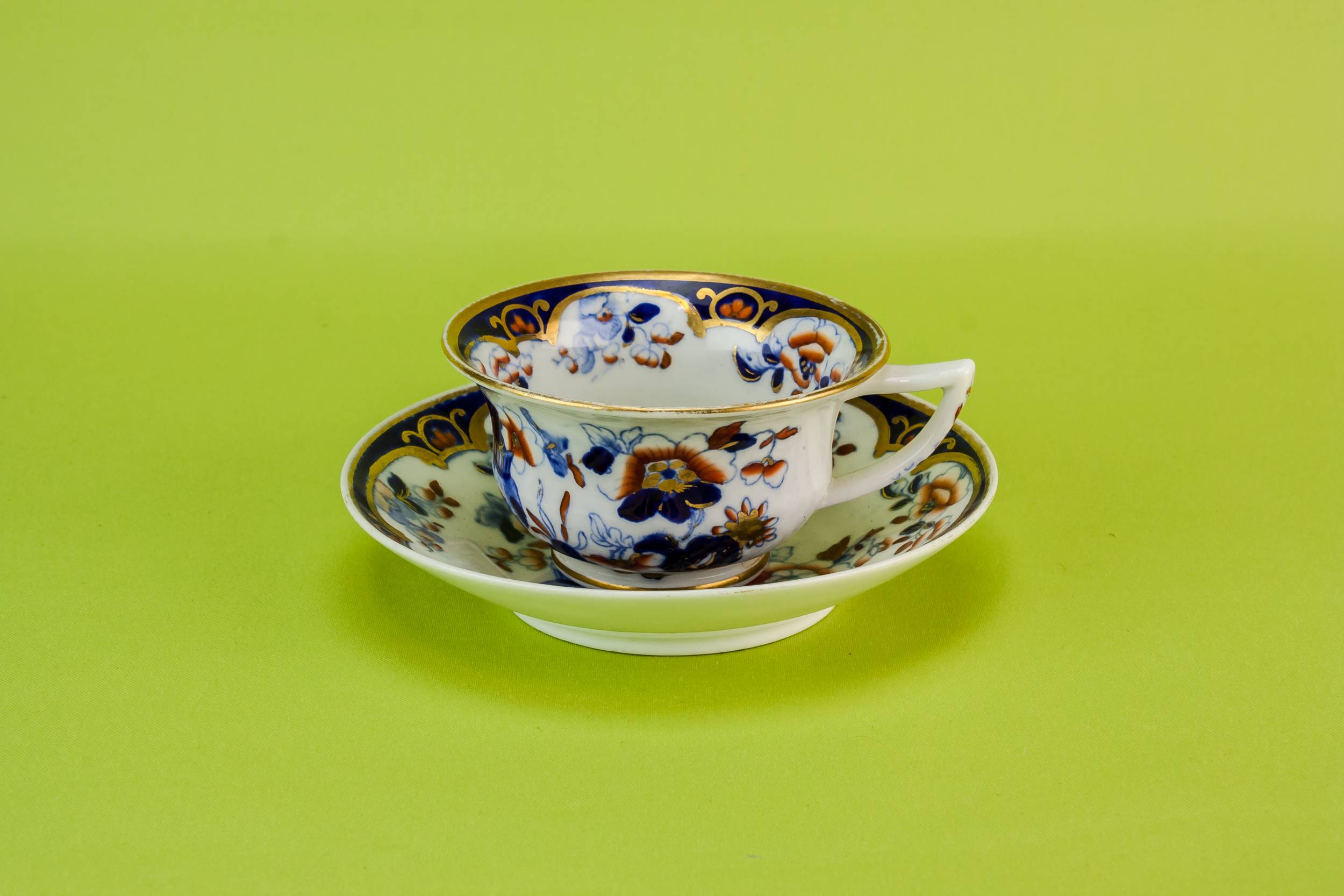 Antique Pottery Cup — Floral teacup & saucer
