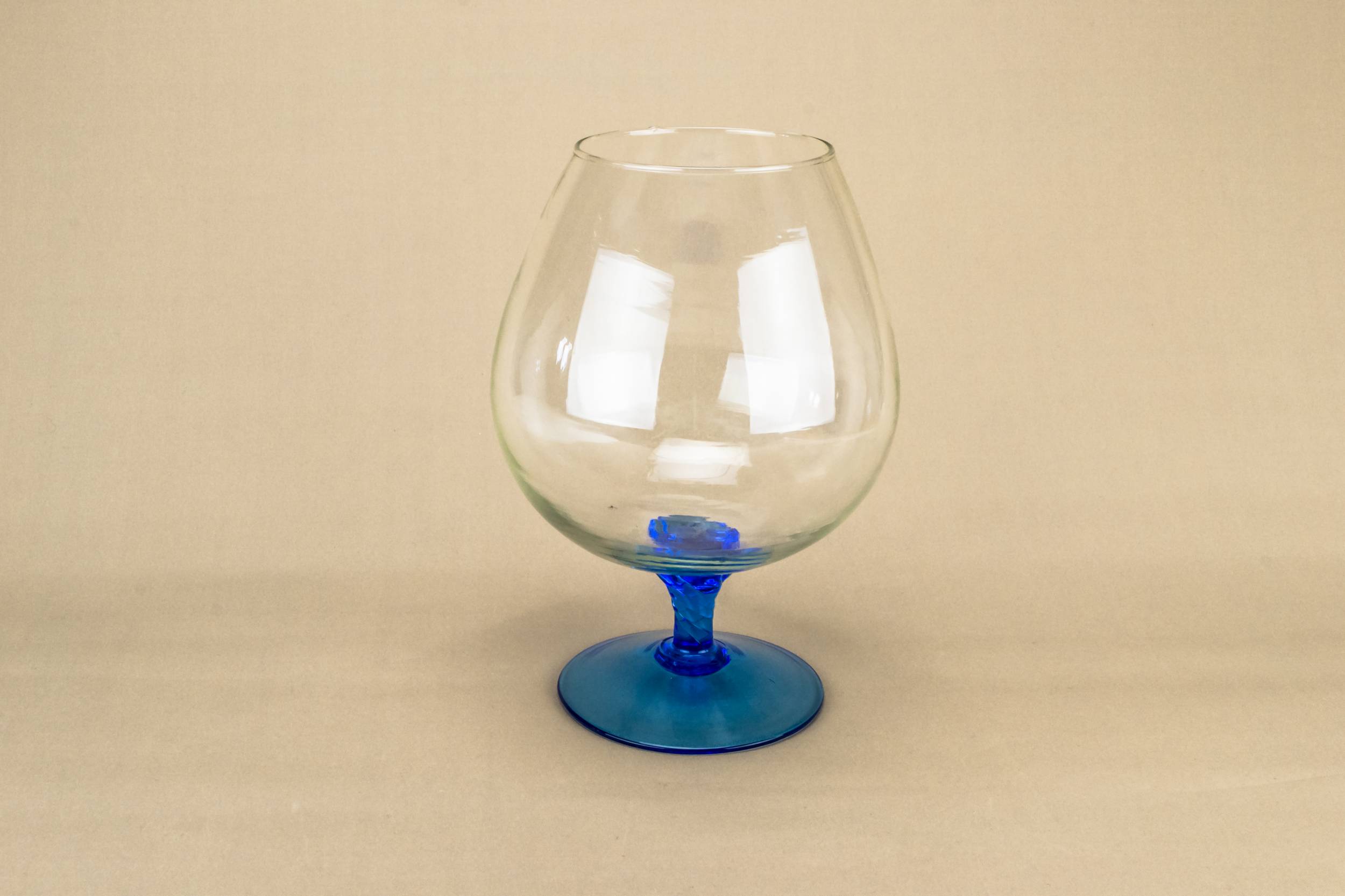 Elegant Vintage VASE — Blue glass vase on foot